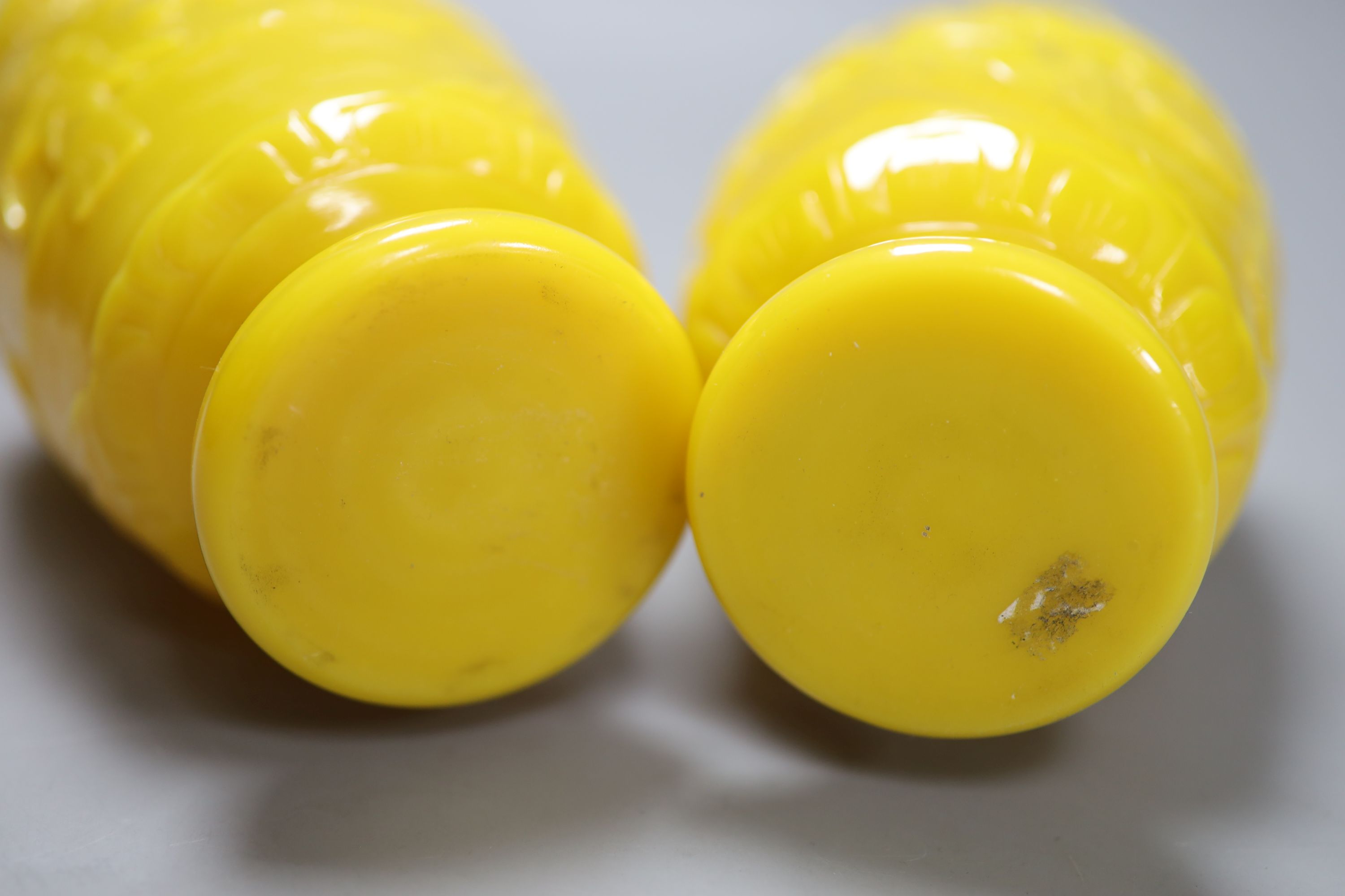 A pair of Chinese Beijing yellow glass vases, c.1900, height 21.5cm